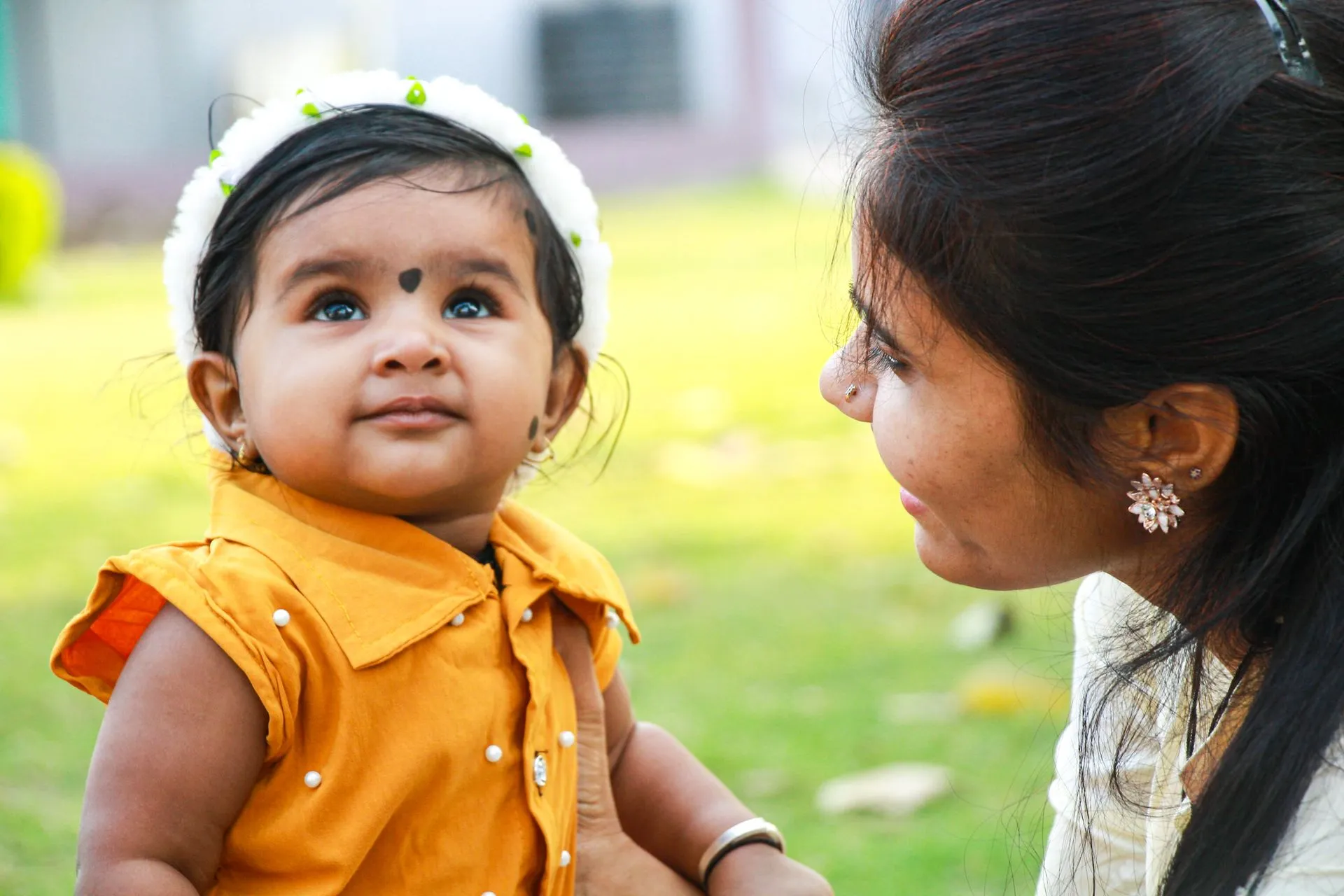 Indian mother holding baby — smart parenting tips